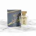 MUD Musk & Oud perfume bottle with blue box on marble background