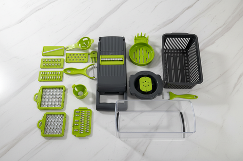 All 16 pieces flat lay — blades, graters, colander and accessories