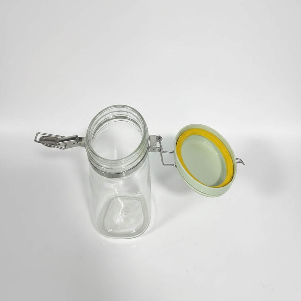 Glass container open showing mint lid and silicone seal — professional studio shot